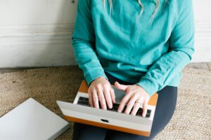 Women website designing on computer