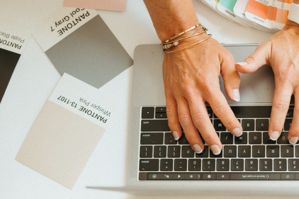 Woman reviewing brand strategy notes at desk — brand positioning for service-based business